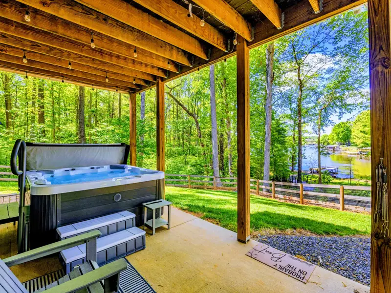 Hot Tub - Café lights, lounge chairs, and a long evening soak after a day on the water.