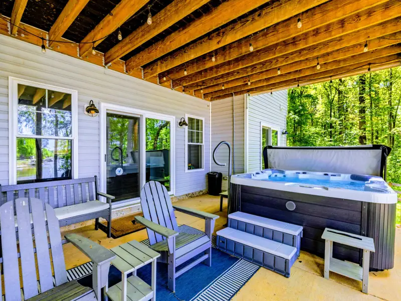 Hot Tub - Covered patio means hot tub time happens rain or shine, day or night.