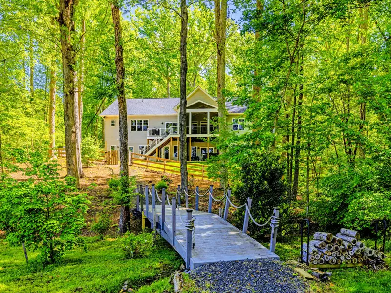 Backyard - Mature trees frame the lake, keeping the yard cool even on hot summer days.