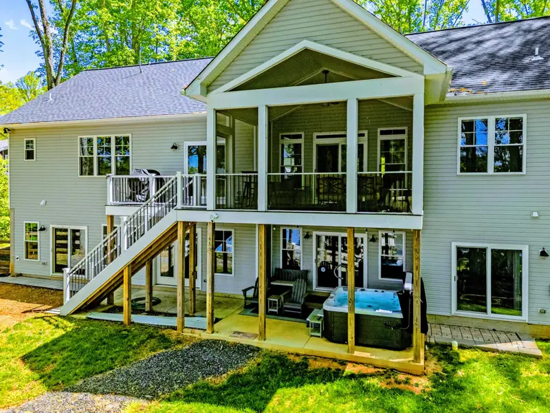 Backyard - Fully fenced backyard rolls down to the water with plenty of room to spread out.