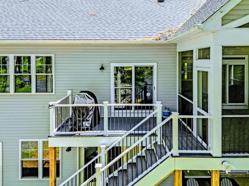 Balcony Deck - Covered upper deck with cove views and outdoor dining.