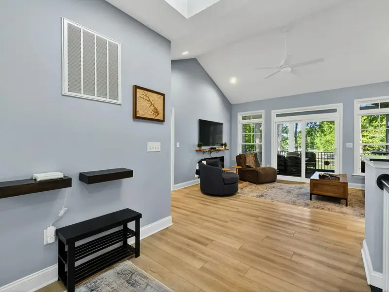 Great Room - Open layout flows from the kitchen to the lake-facing windows.