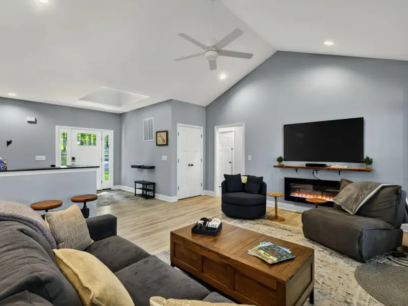 Great Room - The stairs and bar overlook from the entry pull the home together.