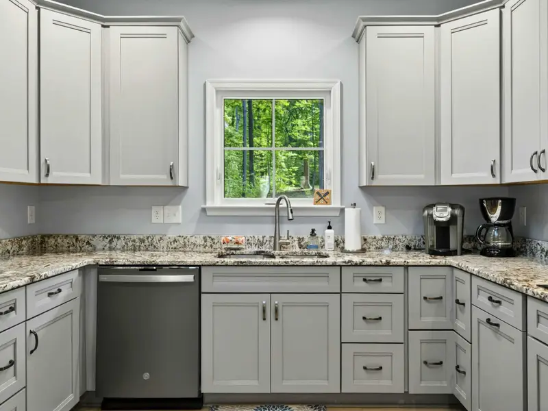 Kitchen - Stocked with cookware, dishes, and small appliances for any meal you want to make.