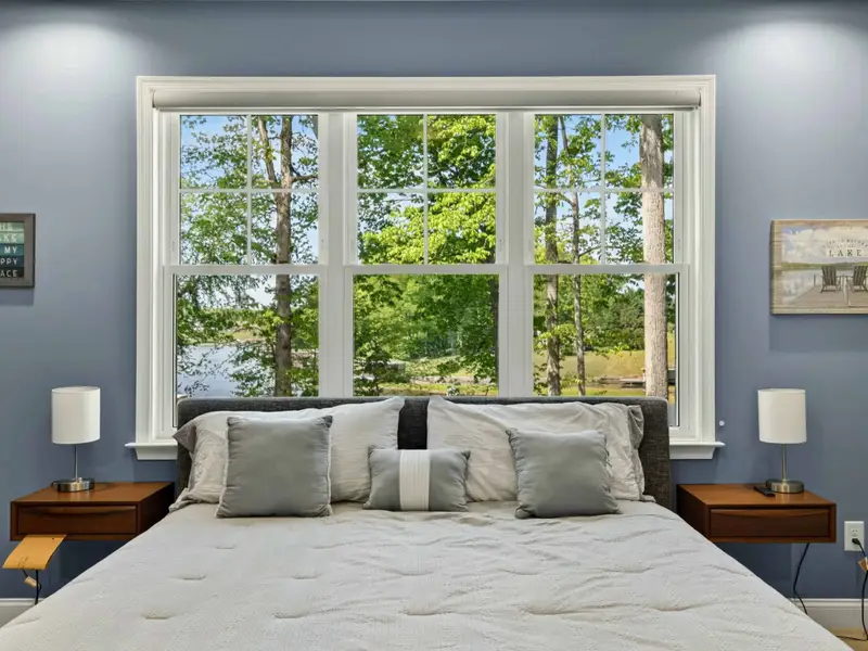 Suite 1 - King bed with crisp linens and a light, calm color palette.