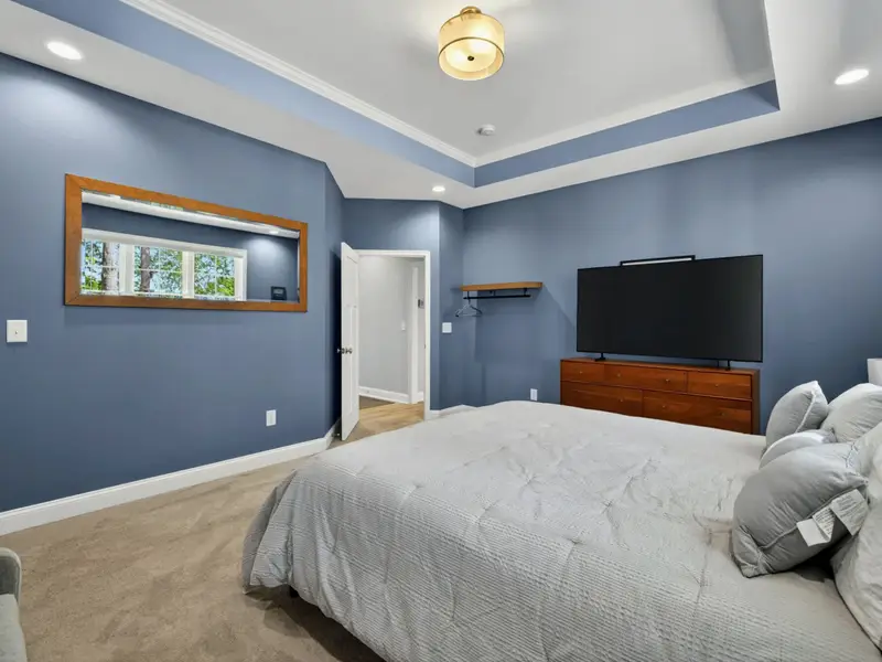 Suite 1 - Ceiling fan, ample natural light, and a private door to the bath.