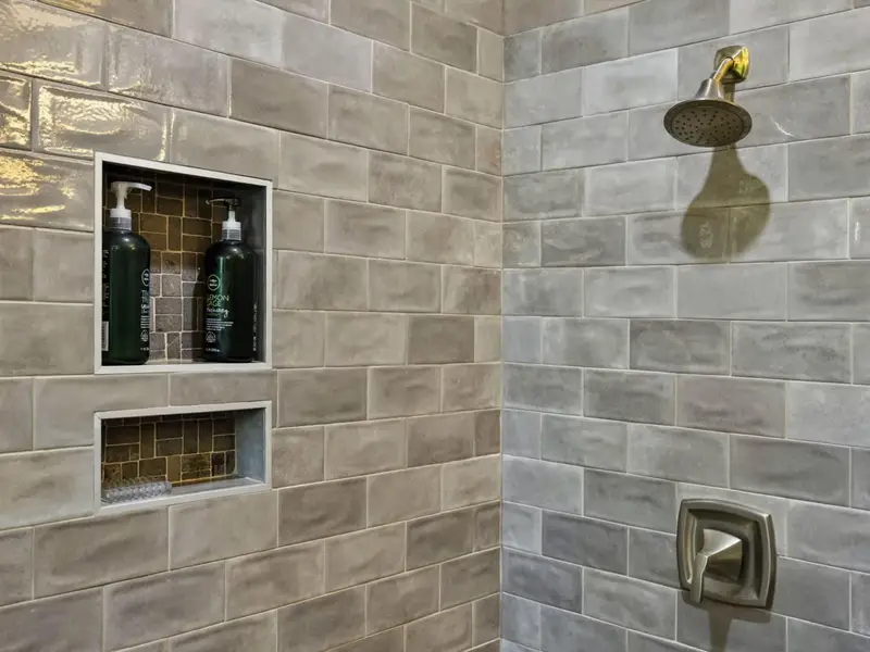 Suite 1 Bath - Modern shower with built-in niche and bench.