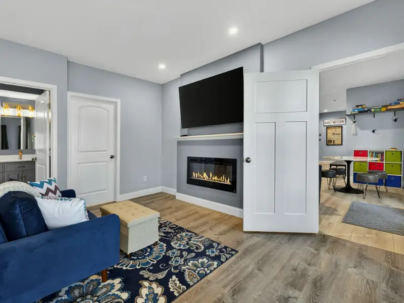 Suite 2 - King bed, sitting area, and patio access steps from the hot tub.