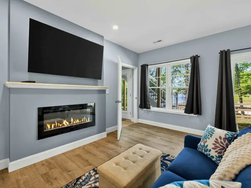 Suite 2 - Electric fireplace, ceiling fan, and sliding door to the lower patio.