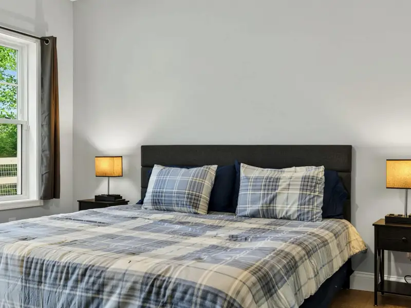 Suite 2 - Comfortable seating area beyond the bed adds breathing room.