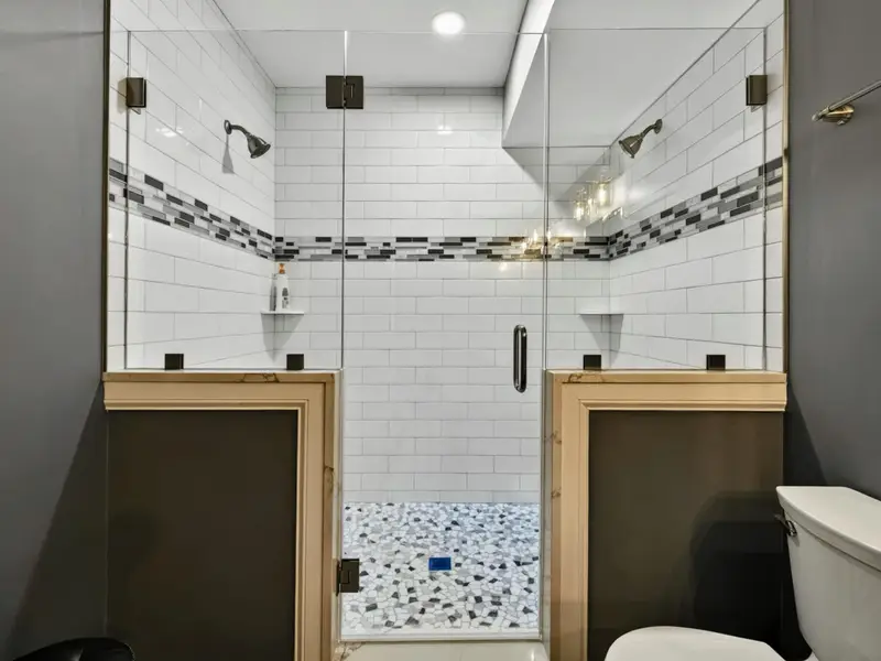 Suite 2 Bath - Modern brass fixtures and a clean, polished finish.
