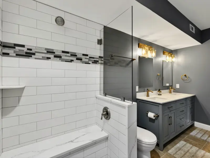 Suite 2 Bath - Walk-in shower with bench and built-in niche.