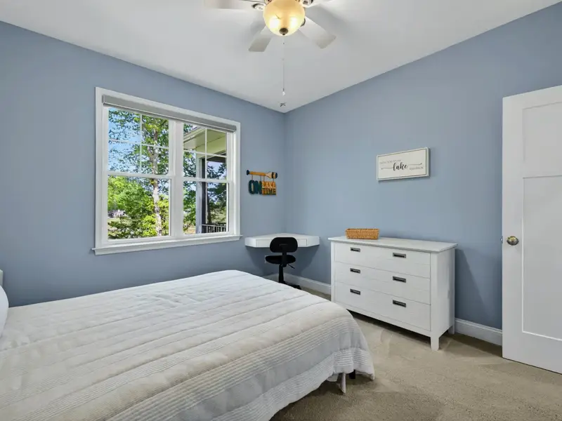 Bedroom 3 - 'On Lake Time' details and a window pointed straight at the water.