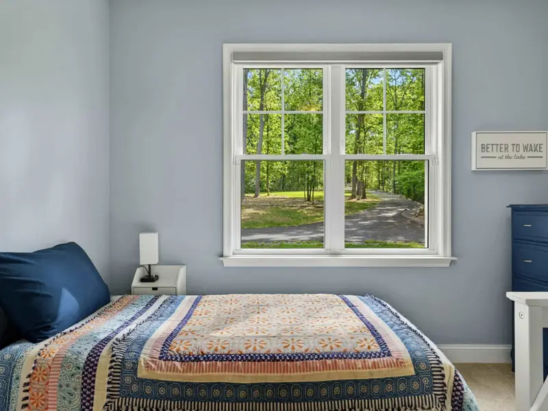 Bedroom 4 - Bright blue palette, ceiling fan, and plenty of natural light.