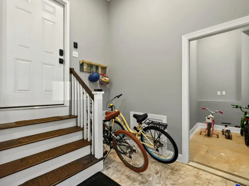 Game Room - Bikes and tricycles waiting at the entry, ready for a quick loop around the cul-de-sac between matches.