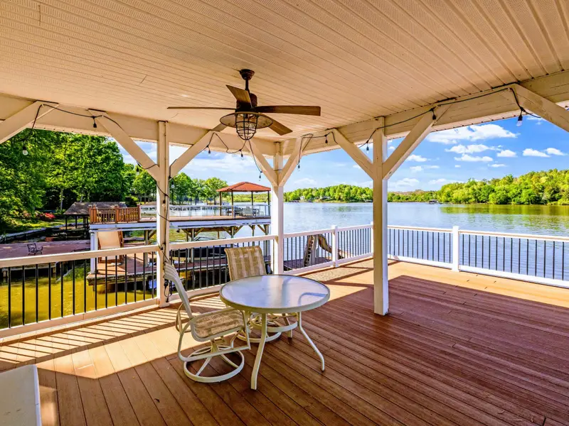 Dock - Ceiling-fan breeze on the covered upper deck makes the warm afternoons easy.