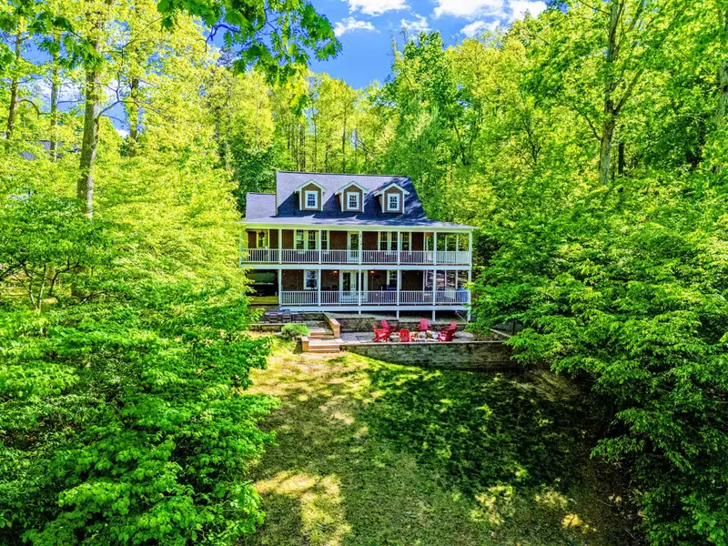 Waterfront - The home from the water, set back behind the trees for privacy and lake views.