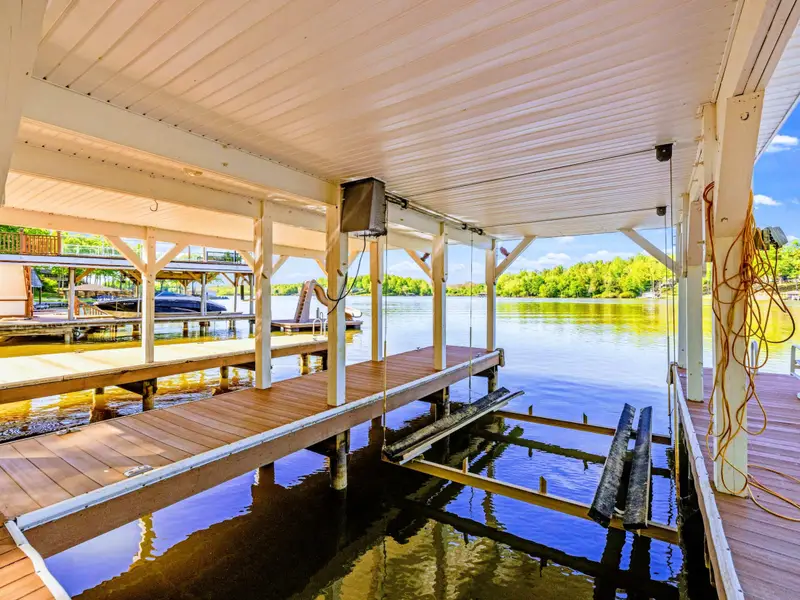 Dock - The lower deck offers two boat slips for easy water access.