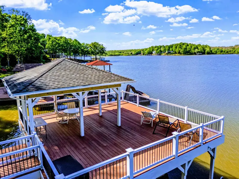 Dock - Table and chairs invite sunset dinners with the lake as the centerpiece.