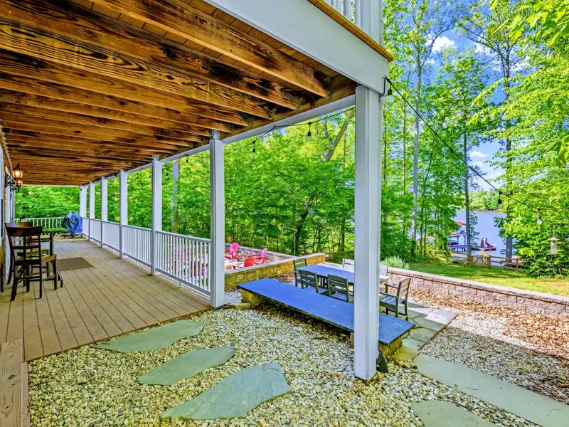 Lower Porch - Long view of the covered ground-level patio, breezy and quiet.