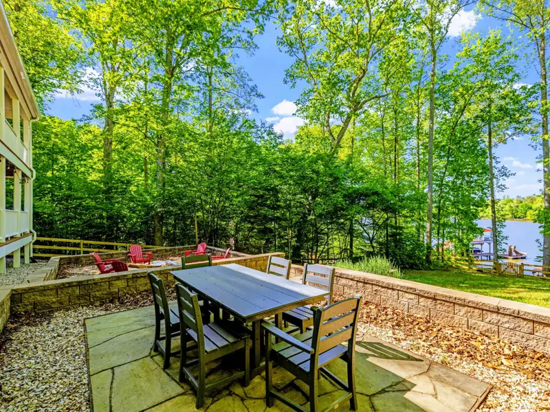 Patio - Outdoor dining and Adirondak chairs around the fire invite you to settle in for the evening.