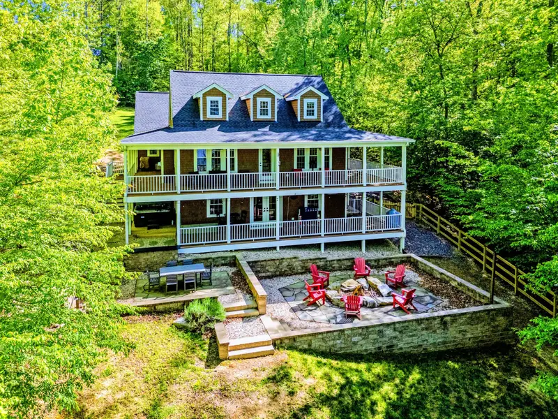 Patio - The full rear of the home from above, two stories of wraparound porches.