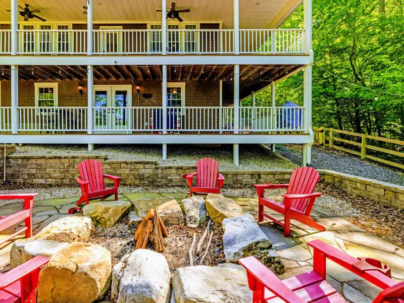 Patio - Two stories of covered porch overlooking the fireplace creates a space where everyone can be connected.