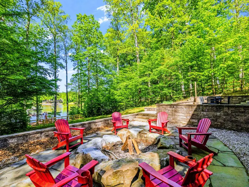 Fire Pit - Red chairs and an open lawn, the kind of gathering that turns into the trip's best memories.