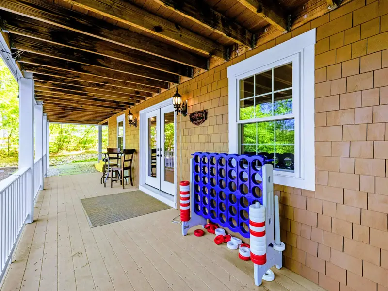 Lower Porch - Giant Connect Four game for family-friendly competition.