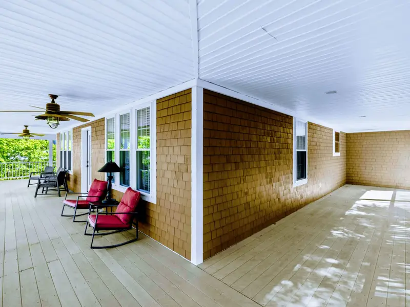 Upper Porch - A long stretch of covered outdoor space, ready for the morning's first cup of coffee.