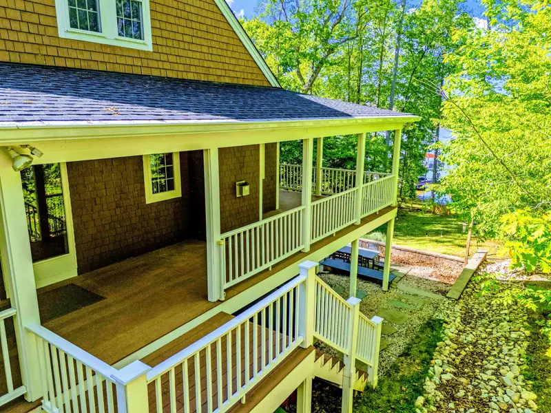 Upper Porch - The two-story wraparound porch wraps the home in deep covered outdoor space.