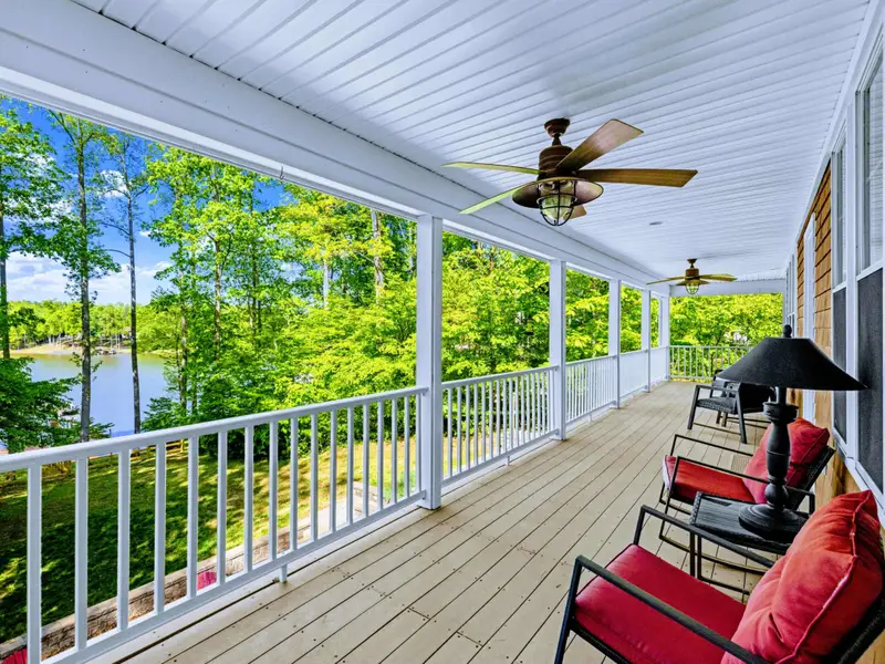 Upper Porch - Enjoy your morning coffee from a cushioned rocking chair while taking in the calm, morning lake.