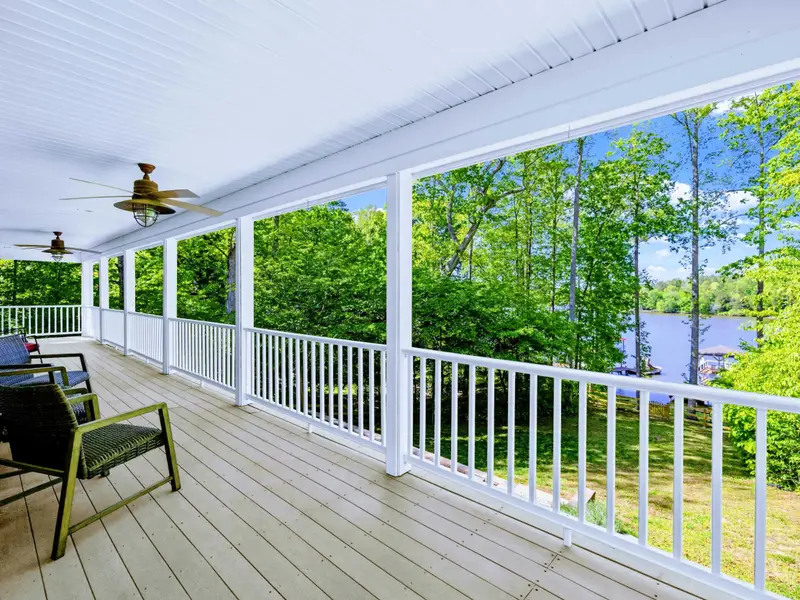 Upper Porch - Ample seating and beadboard ceiling give you the perfect place to relax no matter the weather.