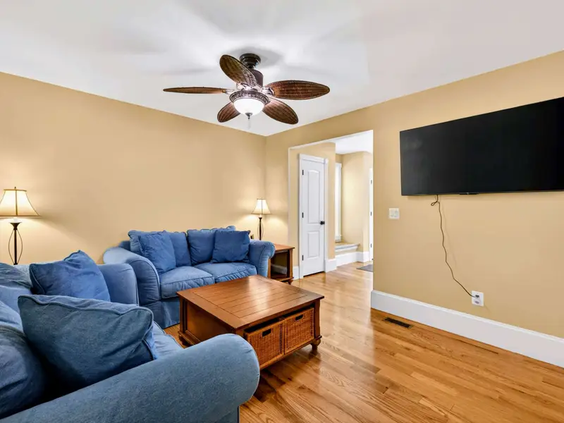 Family Room - Wall-mounted TV and easy seating for everyone who wants a quieter spot to relax.