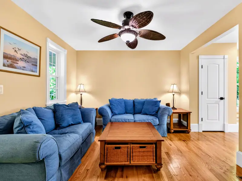 Family Room - Plenty of seating and natural light, with the kitchen and dining areas just beyond.