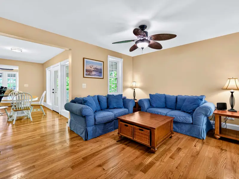 Family Room - Cozy blue sofas and a ceiling fan make this the comfortable everyday-living room.