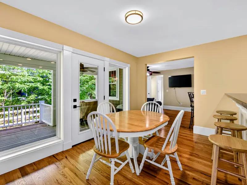 Breakfast Nook - Round table tucked beside the windows, perfect for pancakes and laughter.
