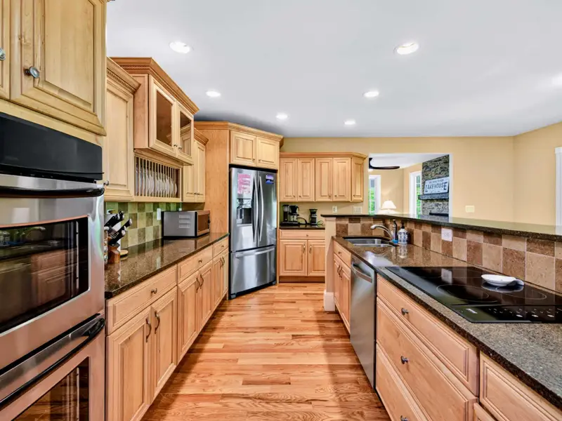 Kitchen - Deep counters and abundant cabinet space, designed for groups who actually cook on vacation.
