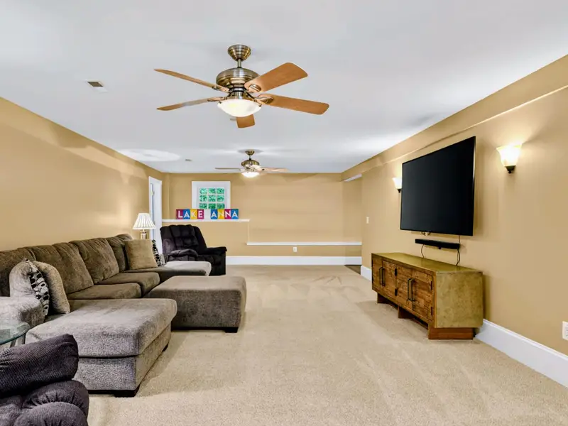 Family Room - Comfortable lower-level lounge that handles game watching, movie nights, or a quiet hour with a book.