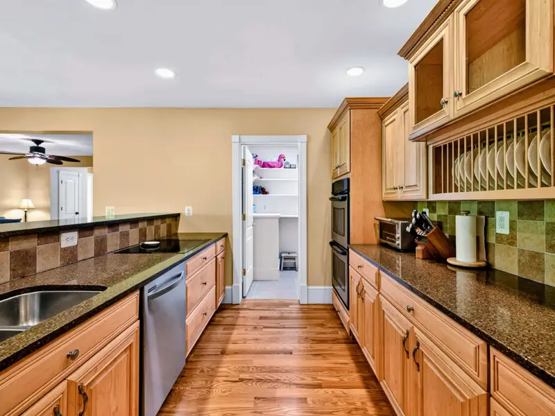 Kitchen - Bar-height seating along the island puts a snack station right in the action.