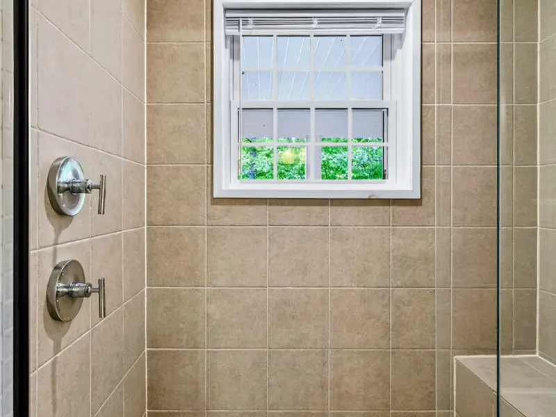 Primary Bath - The full shower from another angle, generous in size and detail.