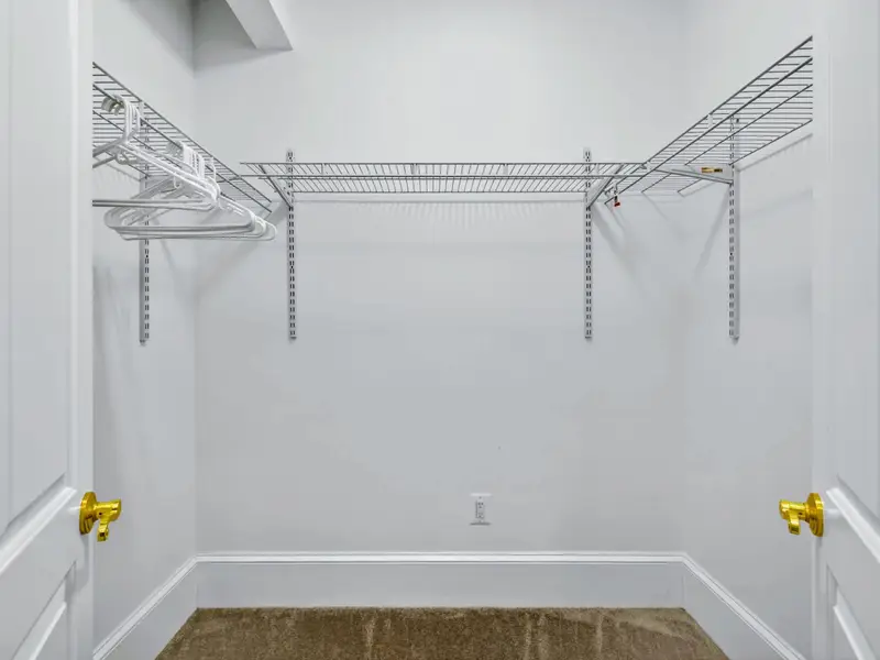 Walk-In Closet - Generous walk-in closet with built-in shelving for the longer stays.