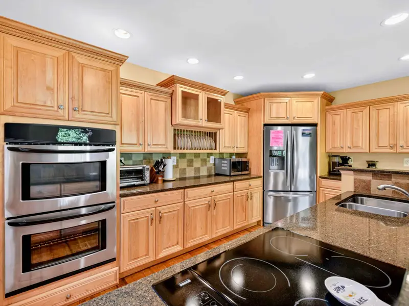 Kitchen - Plenty of room to spread out, with prep zones at every counter and the dining table steps away.