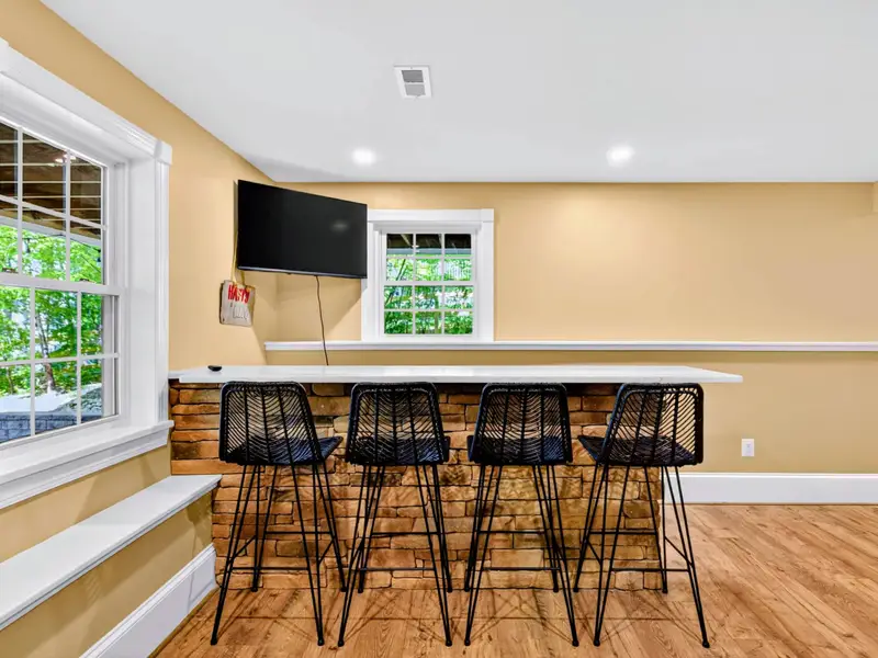 Game Room - Bar seating for drinks and snacks while the games play out a few feet away.