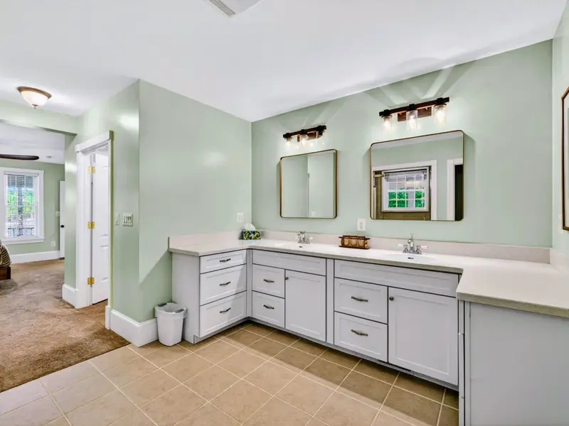 Primary Bath - Two sinks, two mirrors, two of everything for two people getting ready at once.
