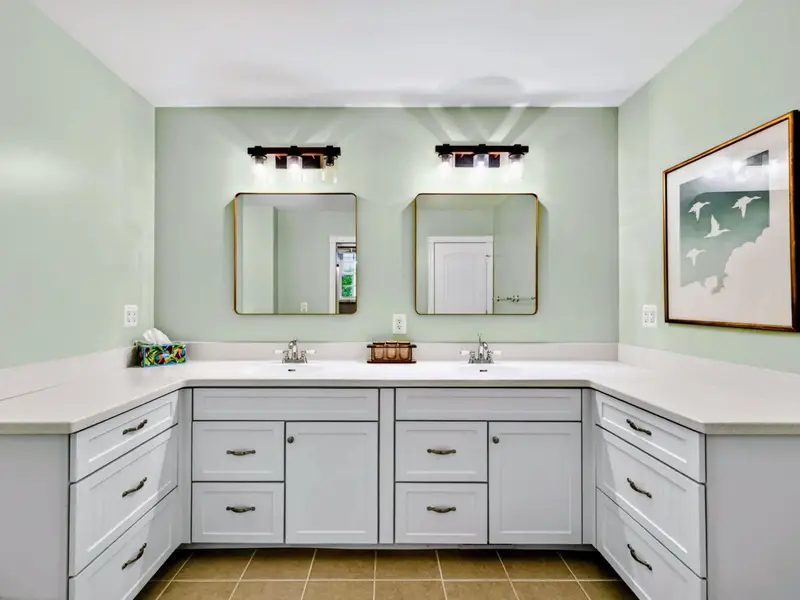 Primary Bath - The vanity zone and toilet area are thoughtfully separated within the ensuite.