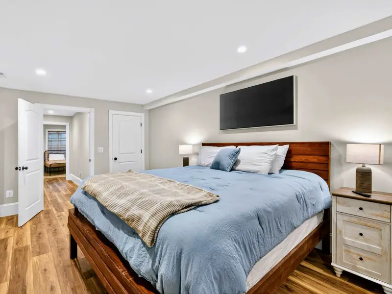 King Bedroom - Generous space around the king bed, plus a wall-mounted TV for unwinding.