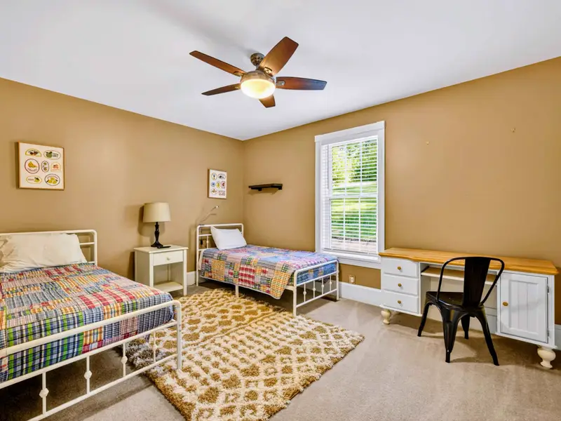 Twin Bedroom - Two twin beds dressed in cheerful plaid, perfect for cousins or kids who like their own space.