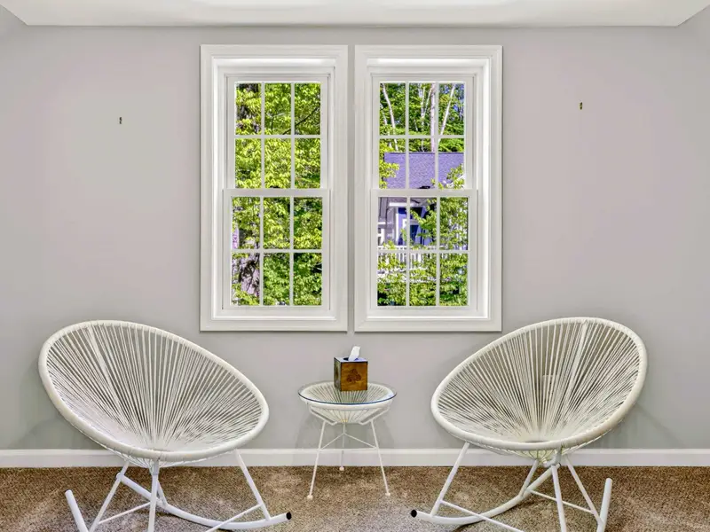 Bonus Room - A pair of modern rope chairs catch the morning light from the dormer windows.