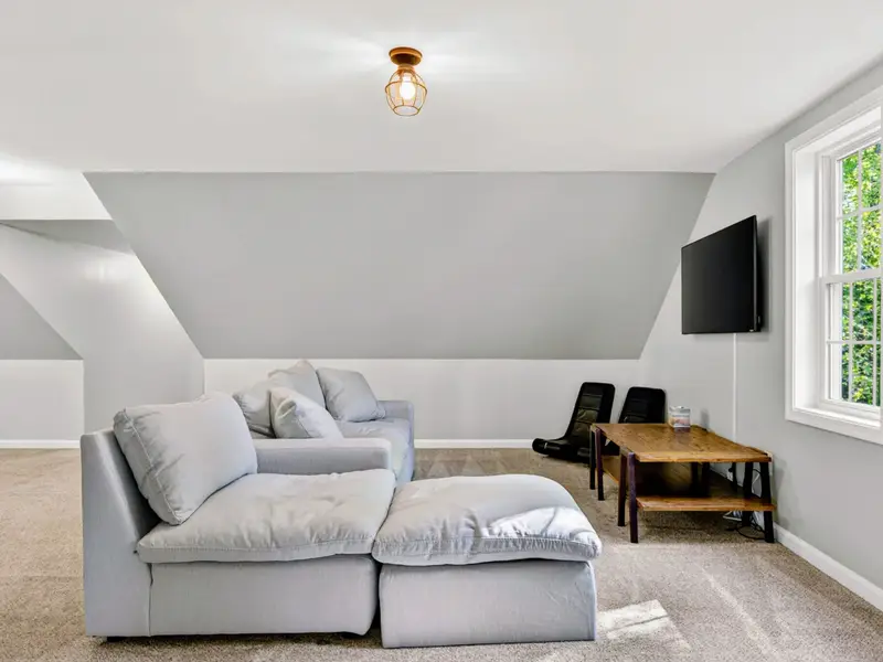 Bonus Room - Sectional sofa and TV setup, perfect for movie marathons or quiet afternoons.